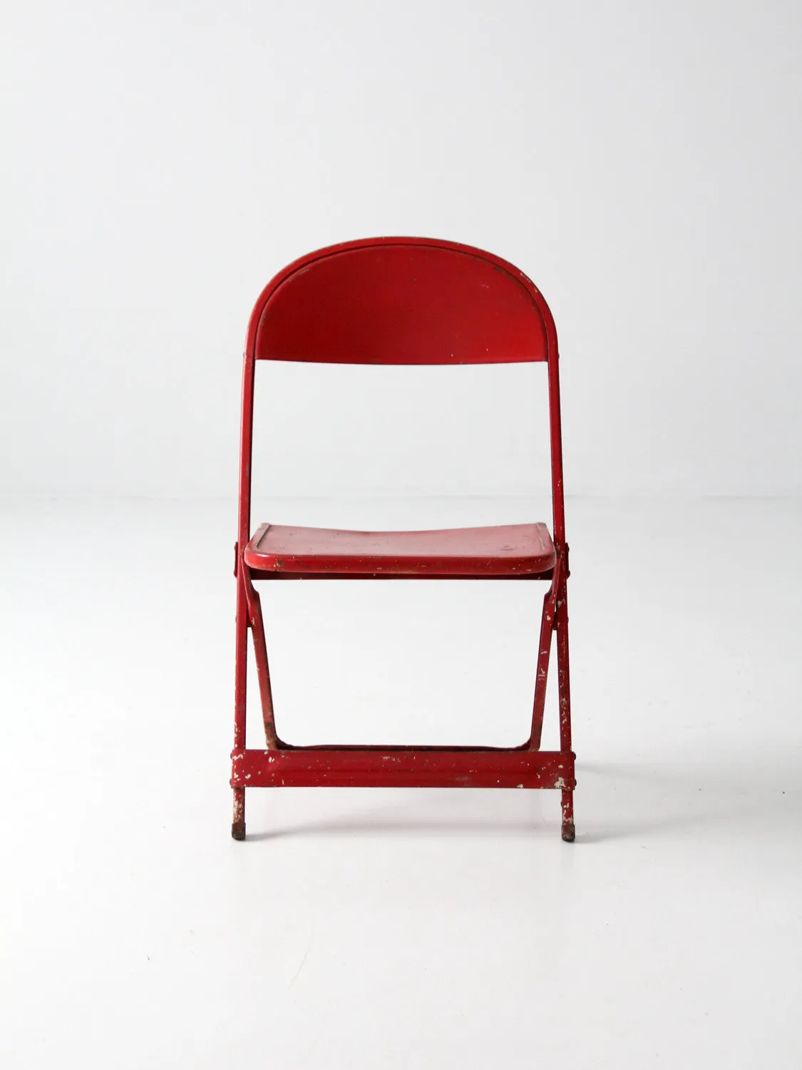 red children's folding chair circa 1950