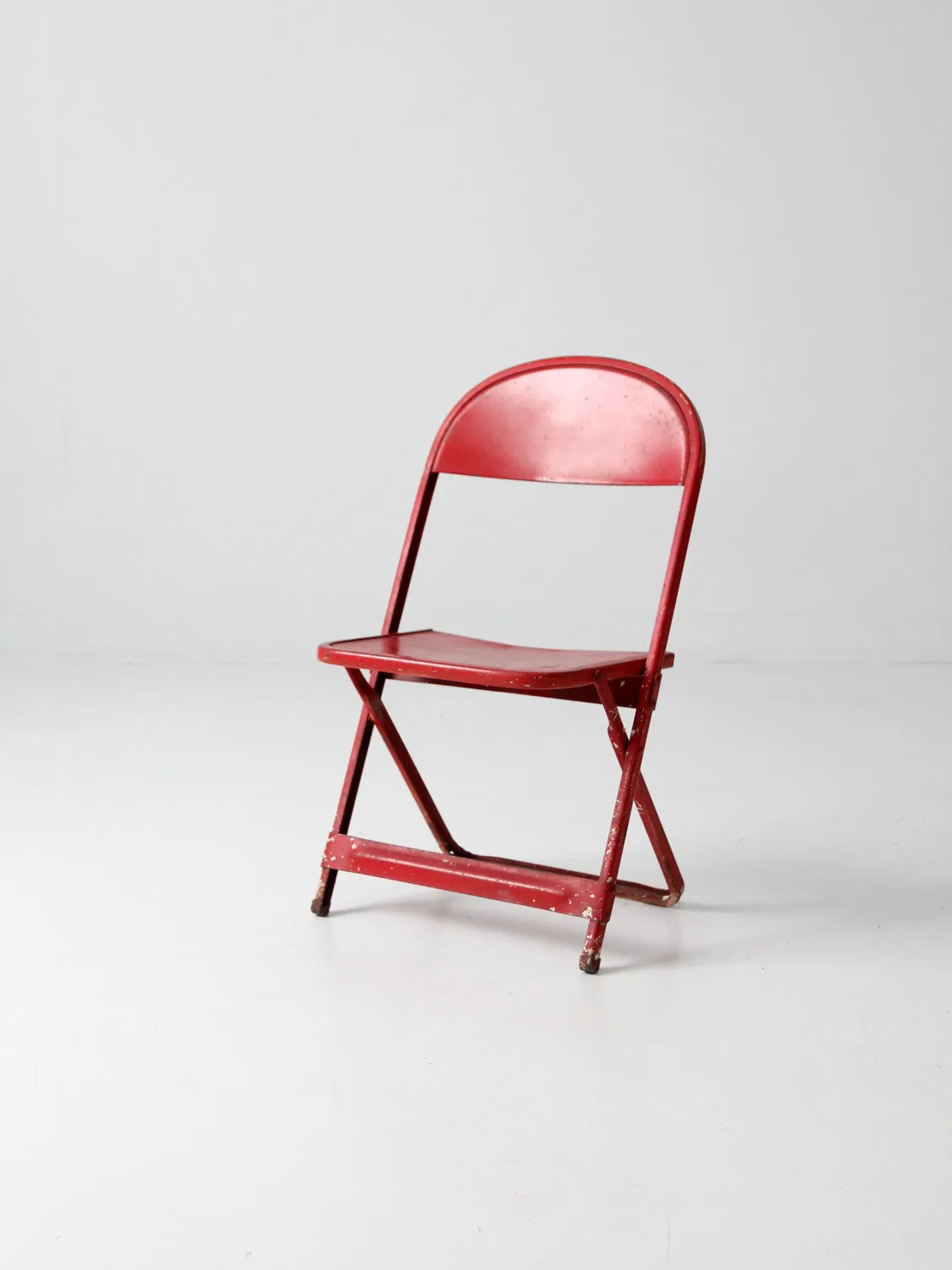 red children's folding chair circa 1950