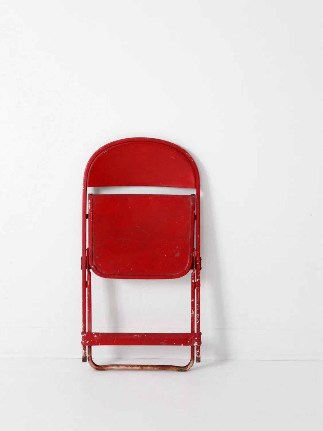 red children's folding chair circa 1950