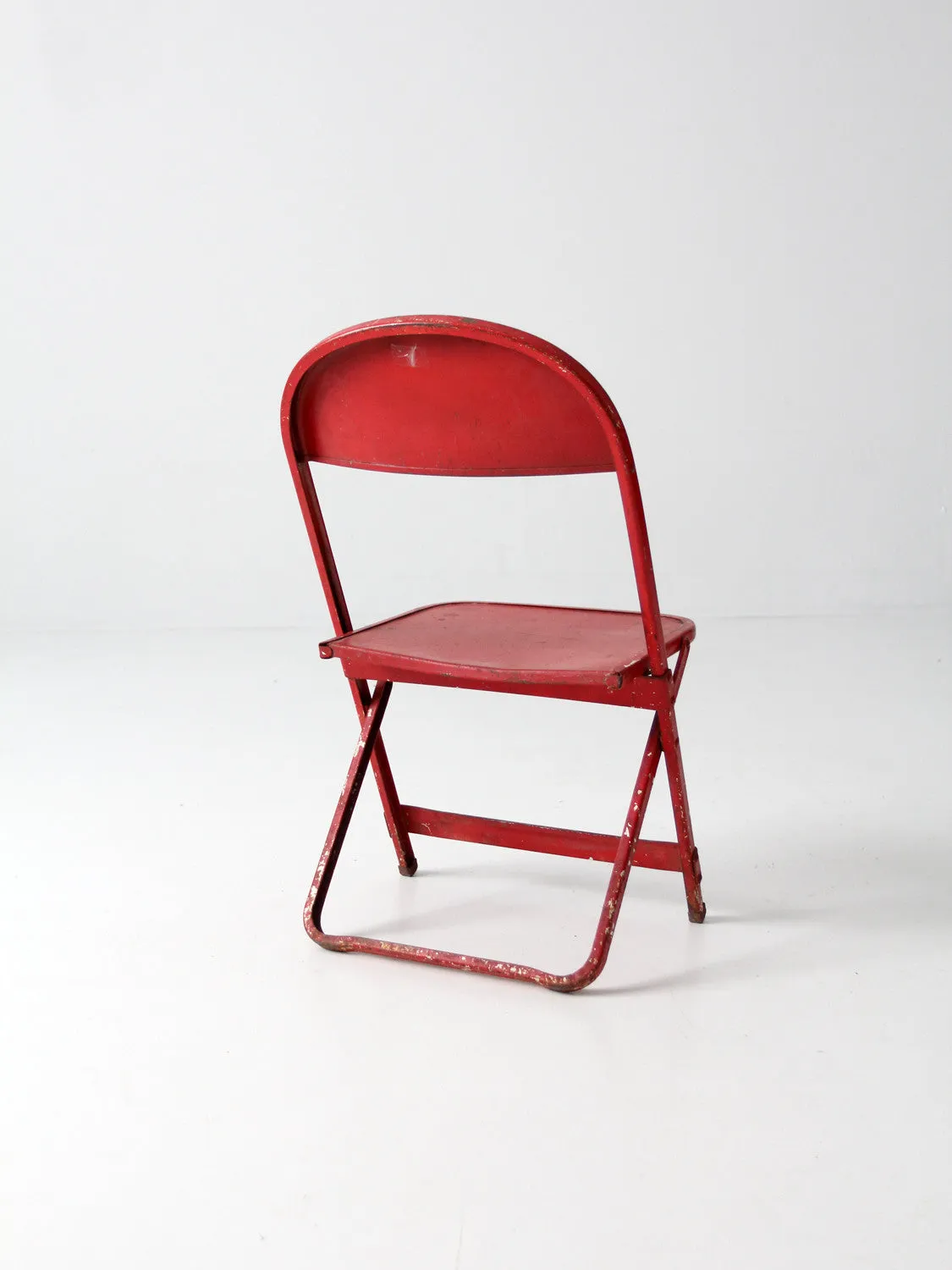 red children's folding chair circa 1950
